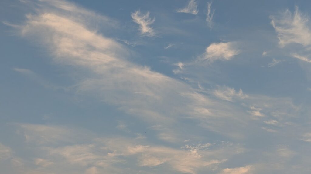 Glass beaker with measured liquid and dropper demonstrating water titration method for benzodiazepine micro-tapering dosag...