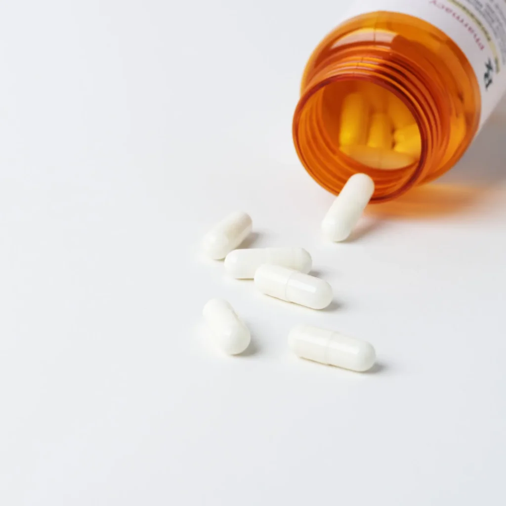 Capsules Spilled From Orange Prescription Bottle