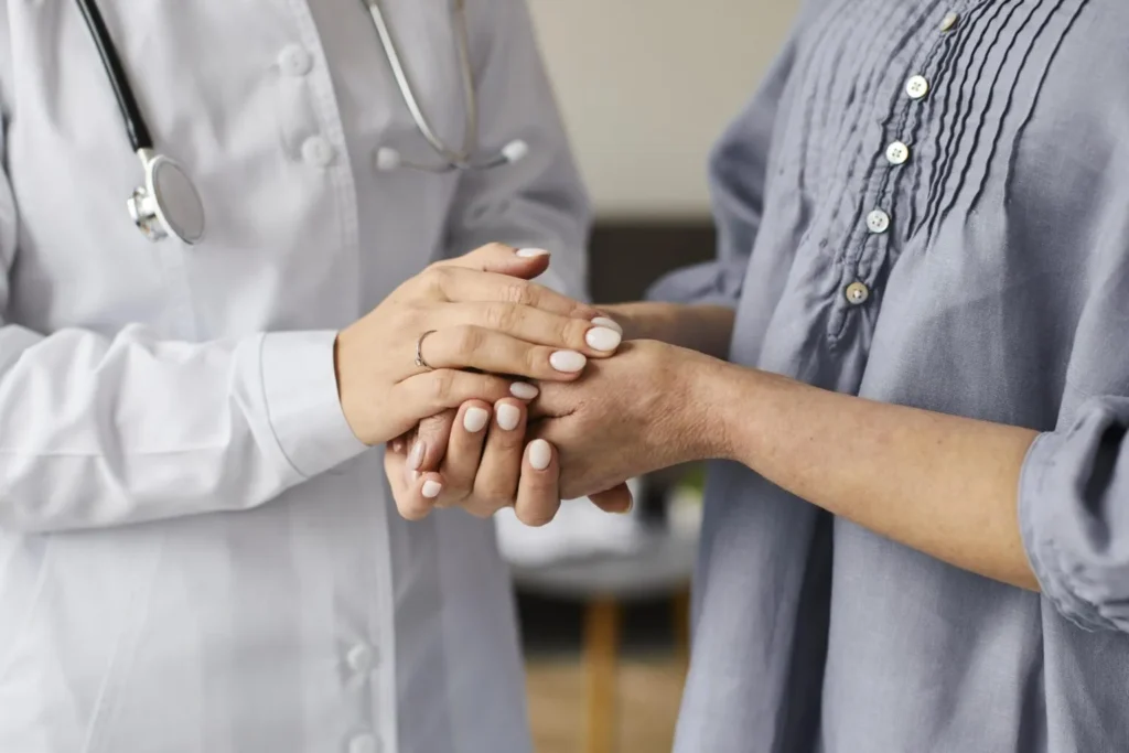 Doctor Holding Patient’s Hands In Support