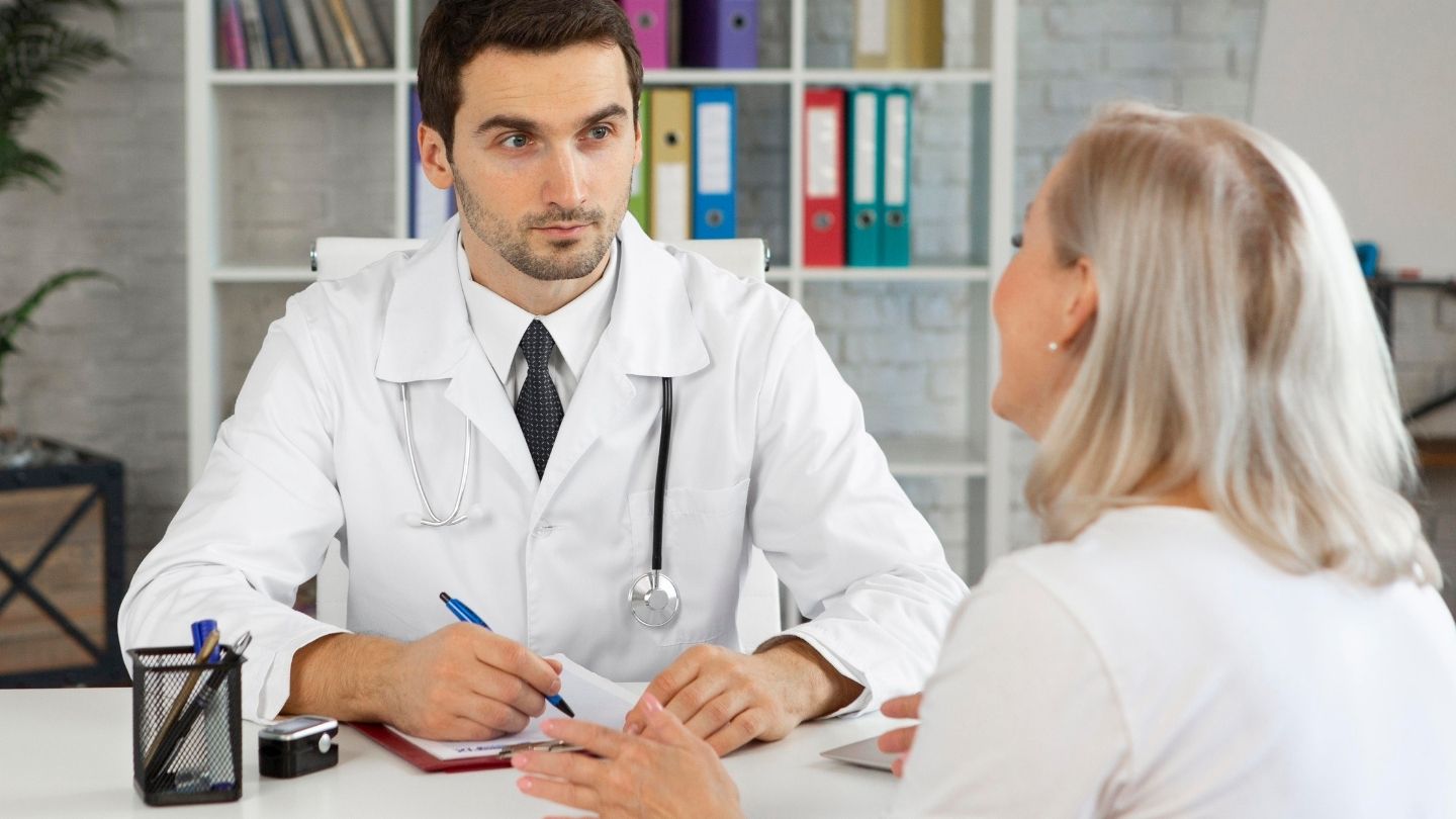 Physician consulting with a patient about a tapering plan during a medical appointment