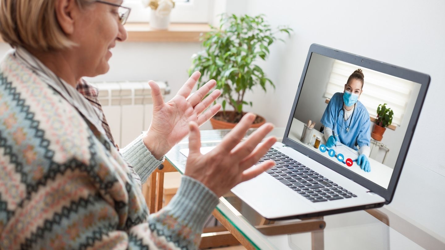 Patient speaking with a physician during a video telemedicine visit