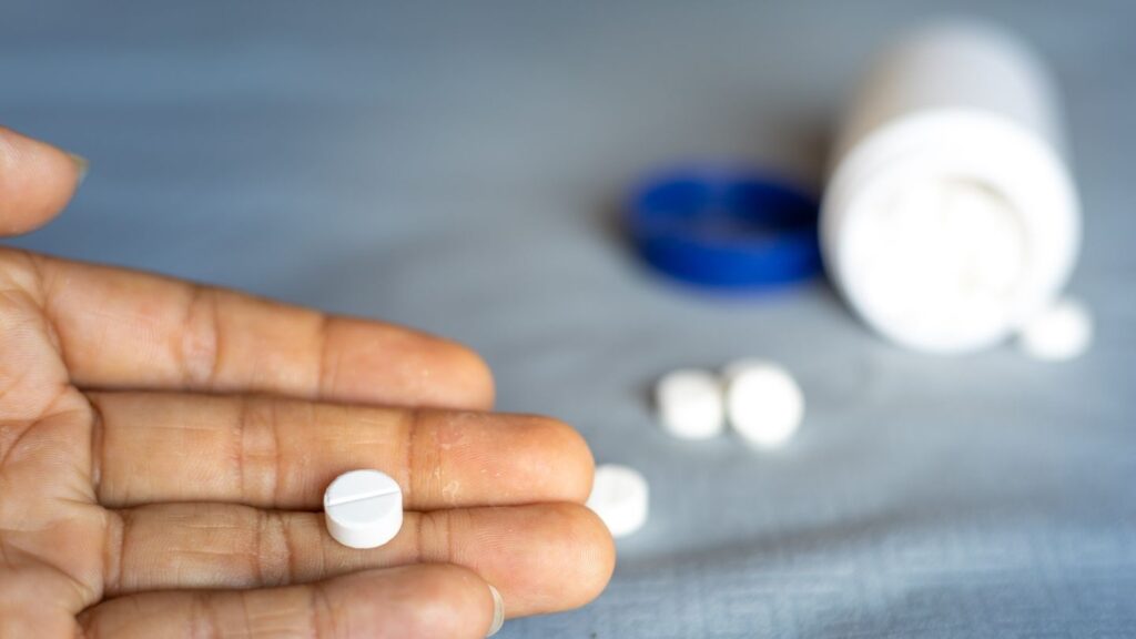 Patient Holding Ativan Pill During Withdrawal Taper